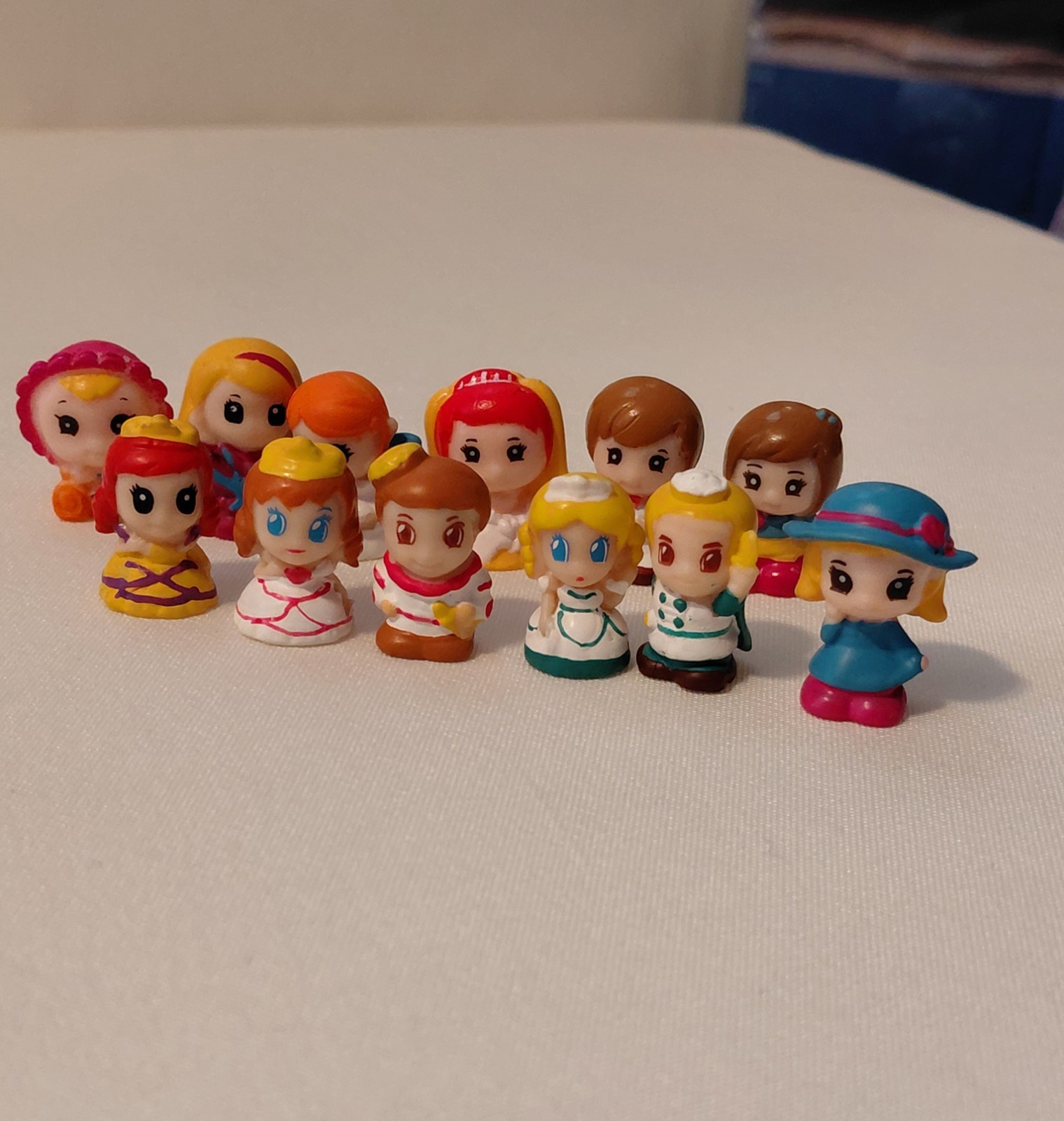 Blip Toys Squinkies Assorted Lot of 12 (Princesses, Princes, Baby, Bride, Groom)