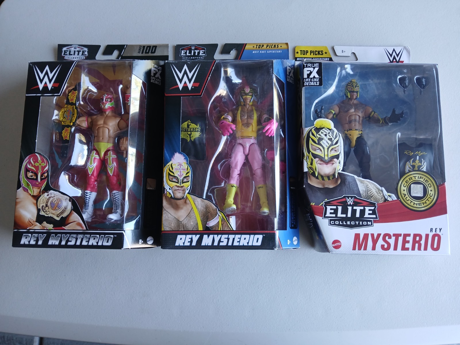 WWE ELITE REY MYSTERIO L0T OF 3 SERIES 100 AND TOP PICKS