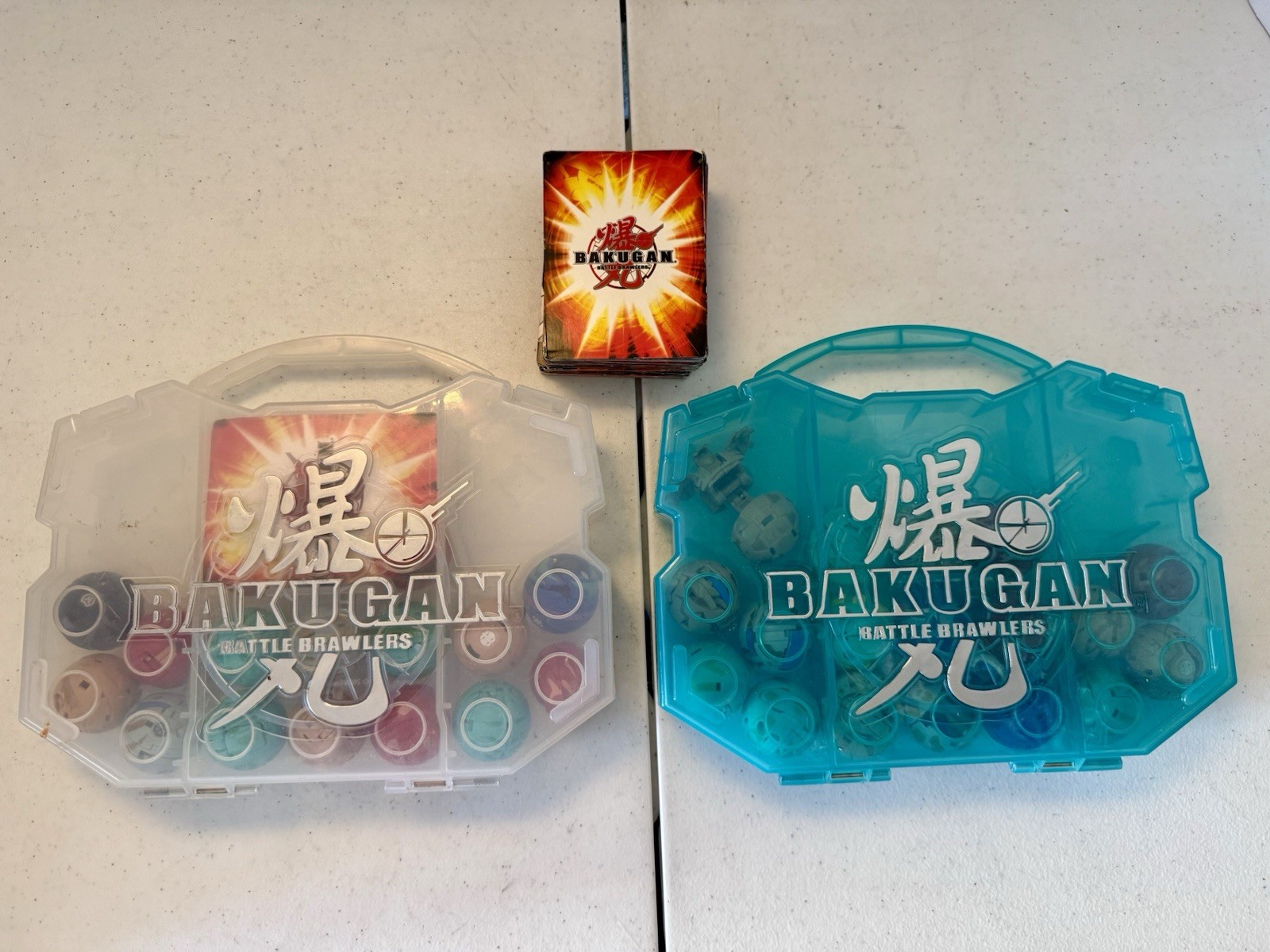 Bakugan Battle Brawlers Lot of 35 Figures, 2 Carry Cases, & Big Deck of Cards