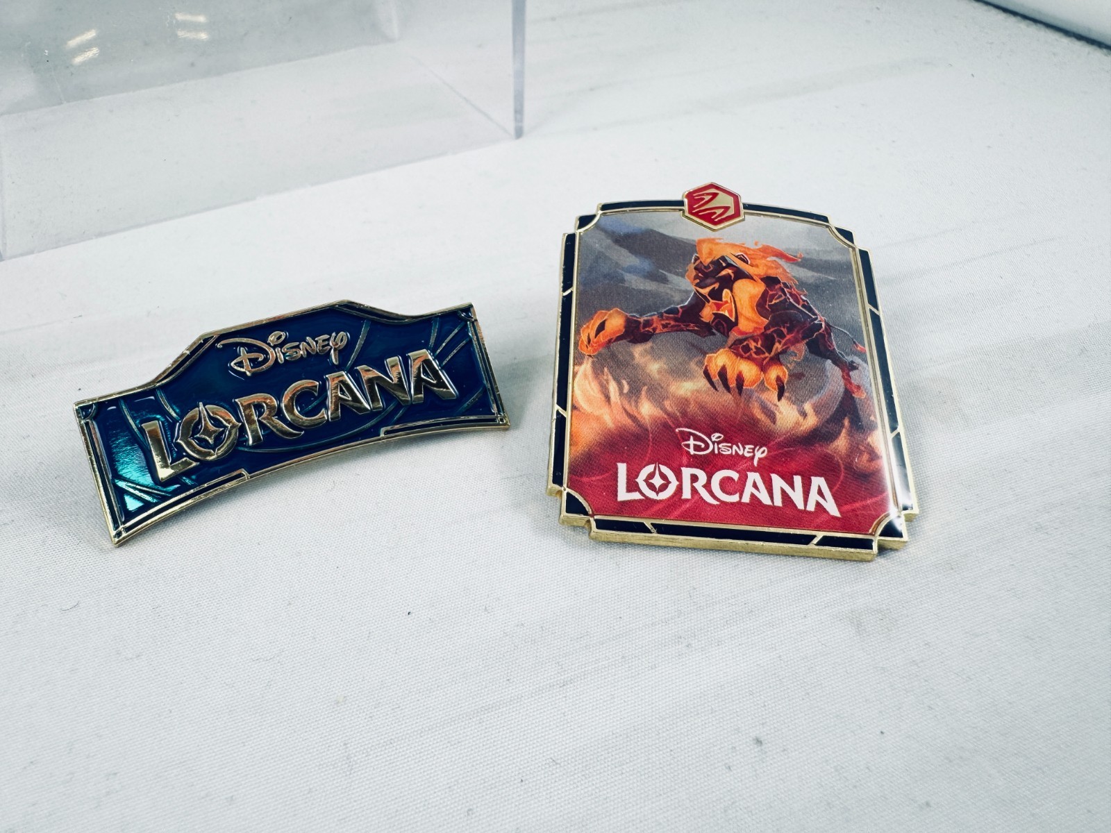 2 Disney Lorcana Enamel Pin set. Logo & Lion King Fiery Scar. NEW Ravensburger