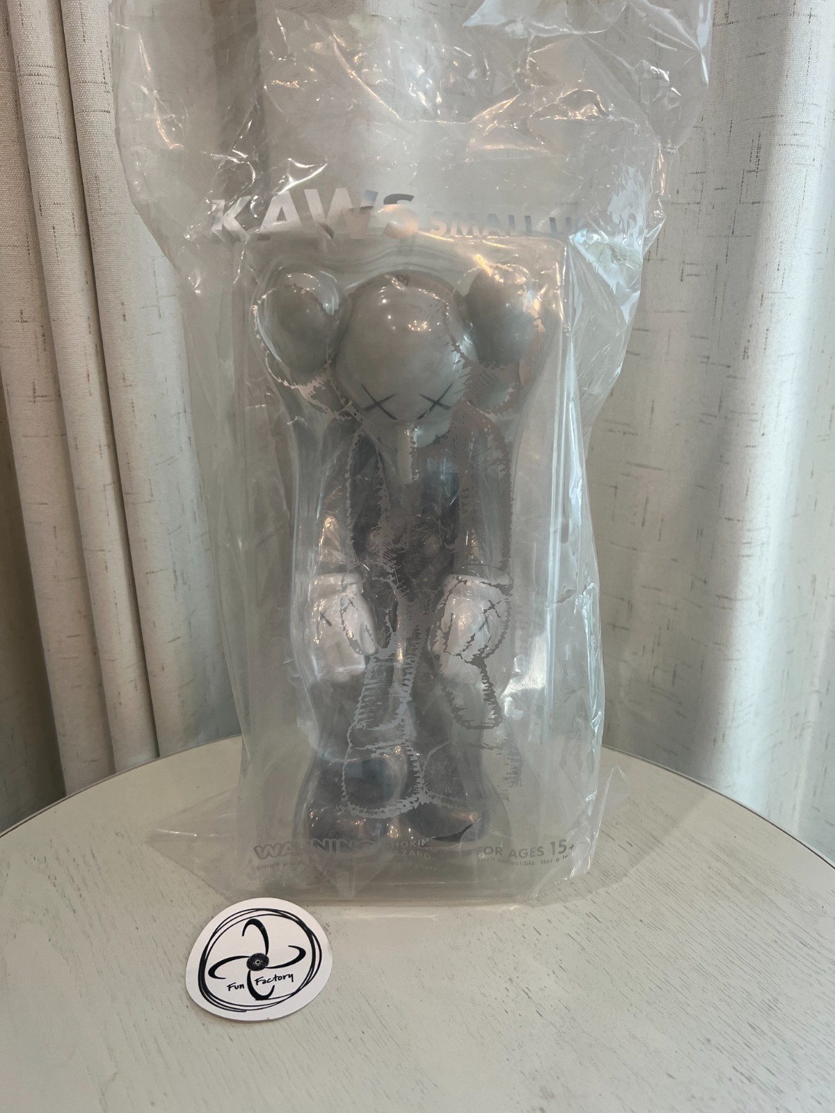 KAWS Small Lie Companion Vinyl Figure Grey