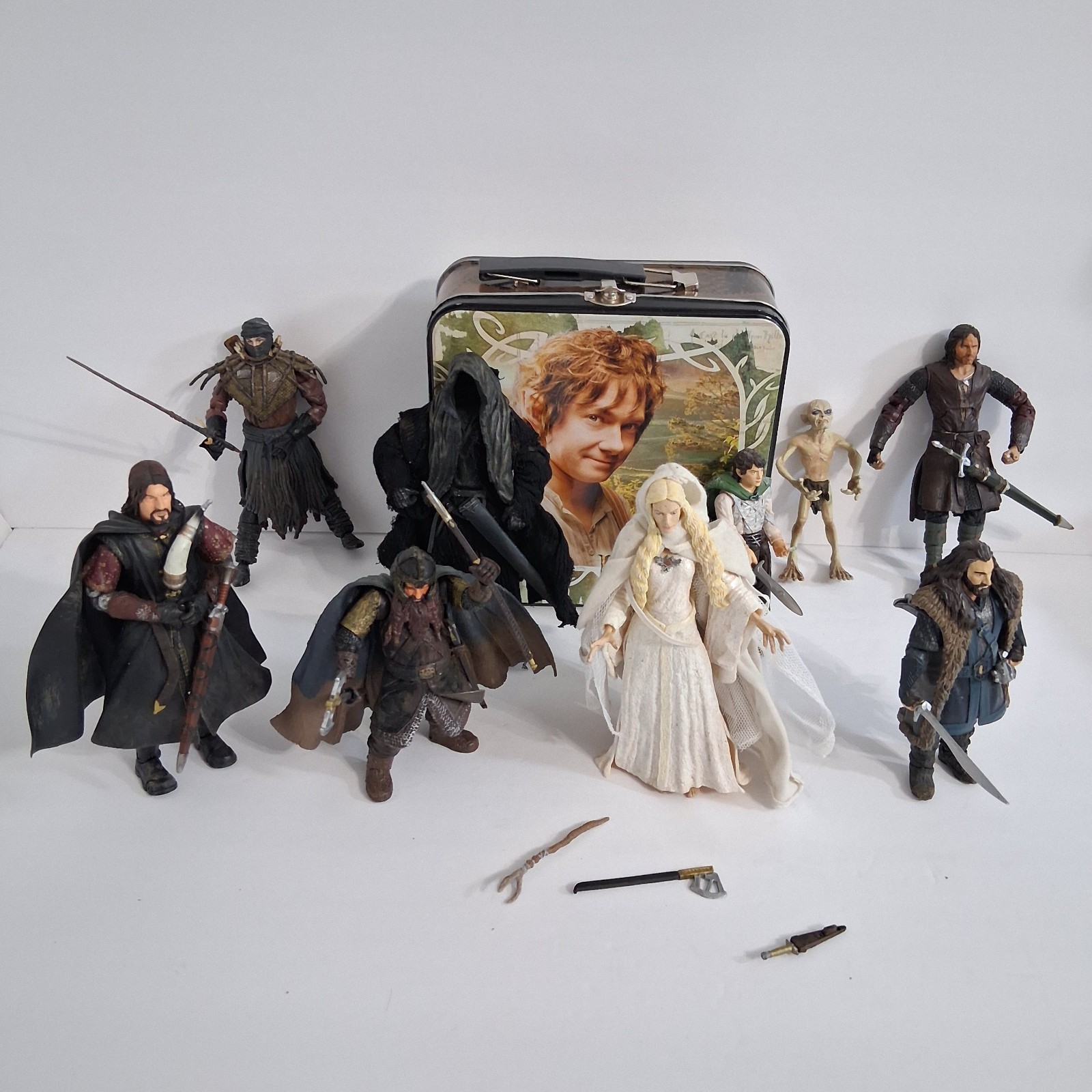 Lord Of The Rings Toy Figure Lot Of 9 In LOTR Lunch Box With Random Weapons READ