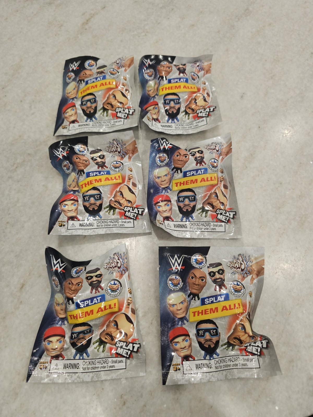 6 WWE Mini Splats Head Collect The 12 Different Wrestlers Stretchy Action Figure